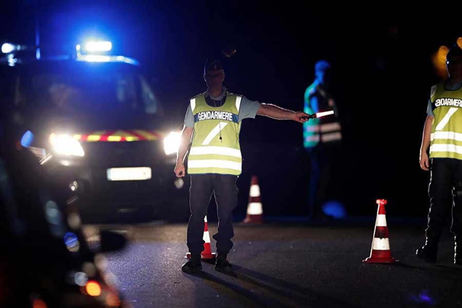 French gendarmes maintain a roadblock a certain distance from the scene where a car ploughed into the outdoor terrace of a pizzeria on Monday.