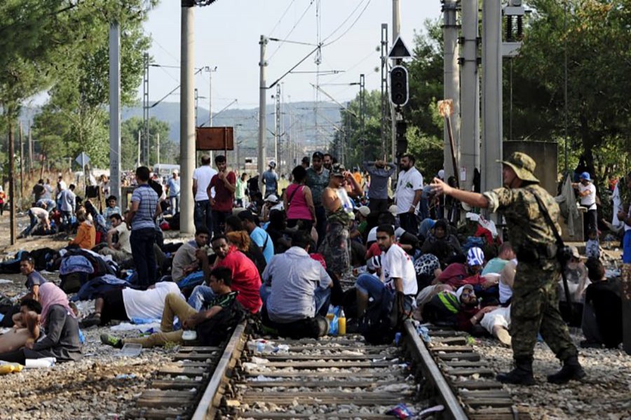 Macedonian special police guard the border as more than a thousand immigrants wait at the border line of Macedonia and Greece. - Reuters file photo