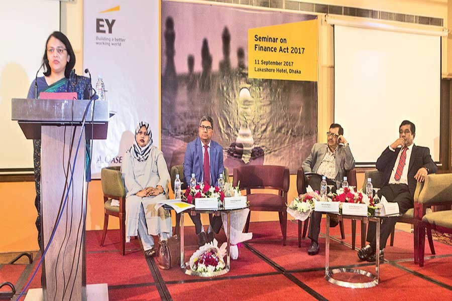 MCCI President Nihad Kabir speaks at a seminar on Finance Act 2017, organised by A. Qasem & Co. (AQC) at a Dhaka city hotel on Monday.  FE Photo