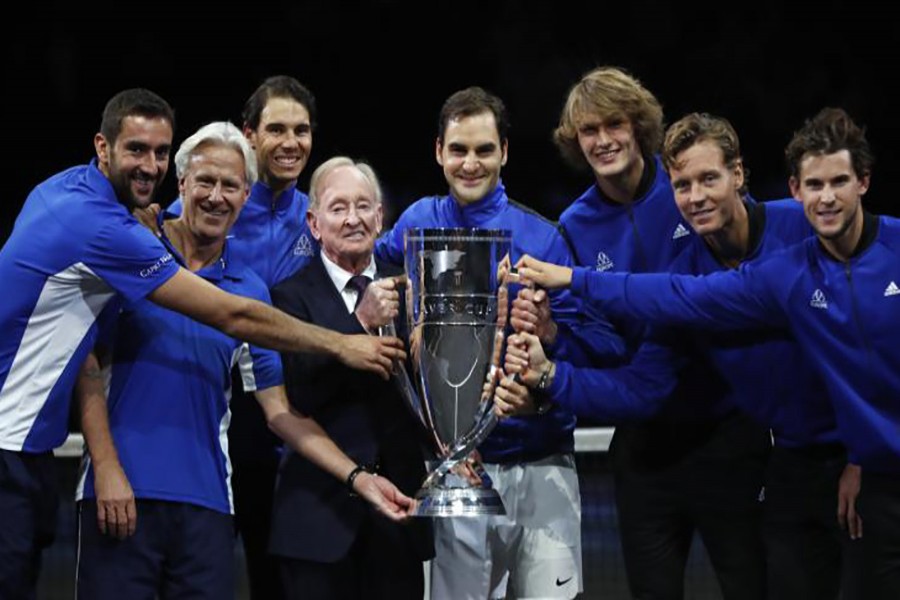 Team Europe together with tennis legend Australian Rod Laver hold the trophy after defeating team World. - Reuters photo