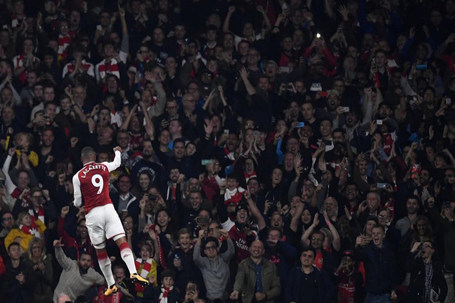 Arsenal's Alexandre Lacazette celebrates scoring their first goal during Monday's clash against West Bromwich. - Reuters photo