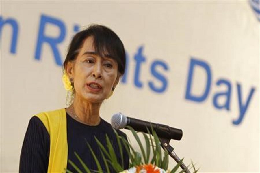 Myanmar pro-democracy leader Aung San Suu Kyi gives a speech on Human Rights Day at Inya Lake hotel in Yangon December 10, 2012. Reuters