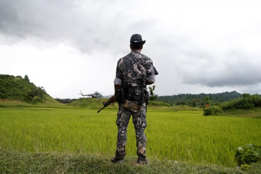 A Myanmar soldier stands near Maungdaw, north of Rakhine state, Myanmar September 27, 2017. Reuters