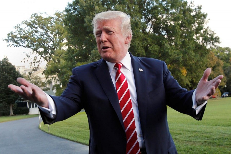 US President Donald Trump talks to the media on South Lawn of the White House in Washington before his departure to Greensboro, North Carolina, US, October 7, 2017. Reuters