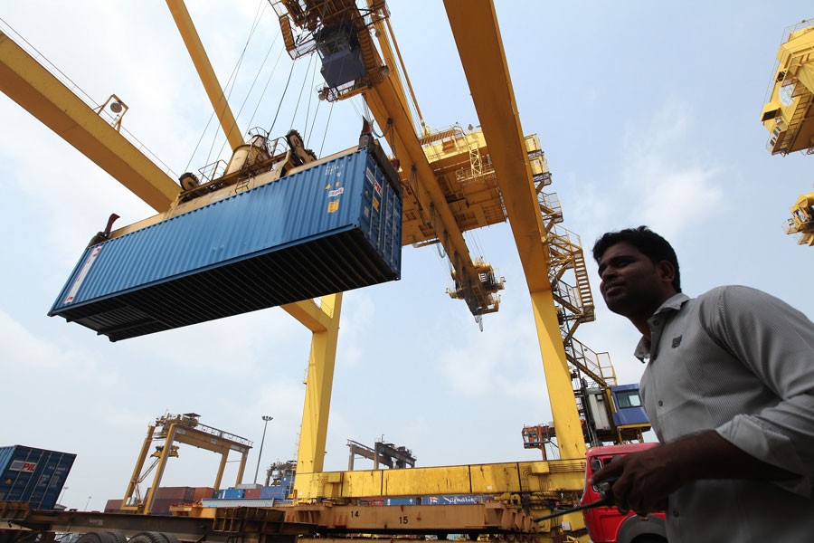 A container is being loaded onto a truck at the Chittagong port in this undated photo collected from the internet.