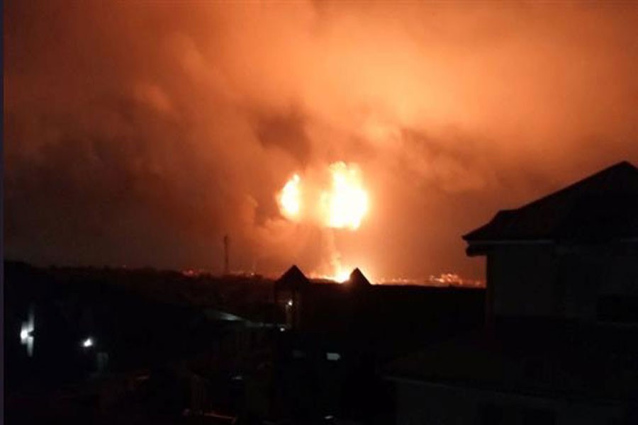 Fire and smoke rise into the sky after an explosion at a natural gas station in Ghana’s capital Accra on October 7, 2017. (Reuters photo)