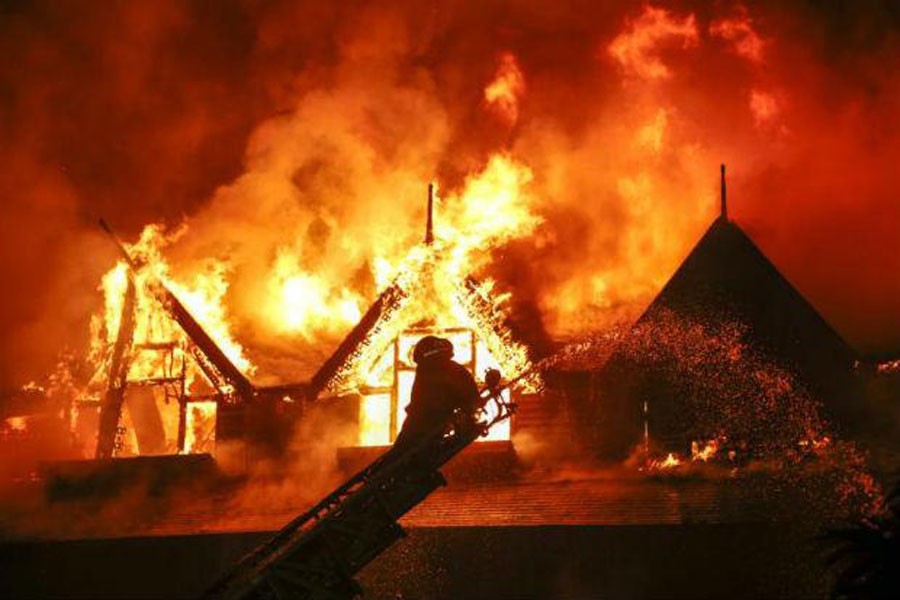 Firefighters attempt to extinguish a fire at the Kandawgyi Palace Hotel in Yangon, Myanmar, on Thursday. (Courtesy- EPA)