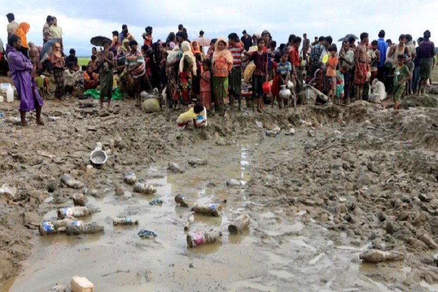 Rohingyas are seen waiting to receive permission from Bangladeshi army to continue their way to the refugee camps, in Palang Khali, near Cox's Bazar, October 17, 2017. Reuters