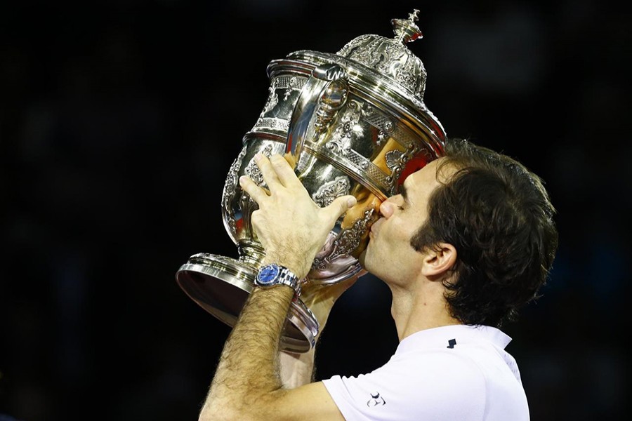 Federer kisses the Swiss Indoors trophy after defeating Juan Martin Del Potro. - Reuters photo