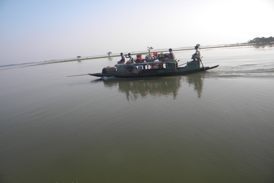 Water still flowing in the haor protection embankment areas in Sunamganj. The photo was taken from Derai upazila on Monday. 	— FE Photo