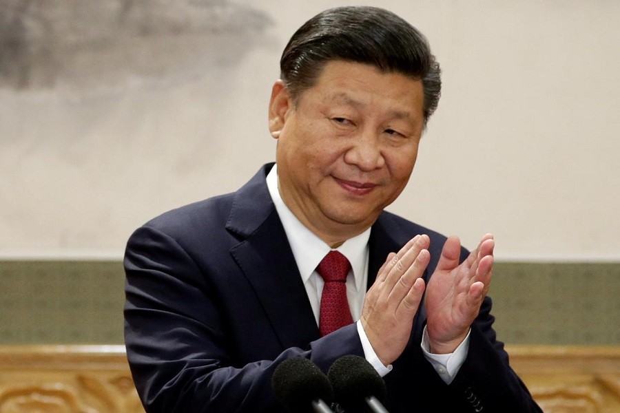 China's President Xi Jinping claps after his speech as he and other new Politburo Standing Committee members meet with the press at the Great Hall of the People in Beijing, China October 25, 2017. Reuters