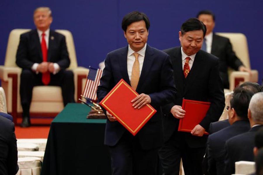 Lei Jun, Founder and CEO of China's smartphone maker Xiaomi, attends signing ceremony with US President Donald Trump and China's President Xi Jinping at the Great Hall of the People in Beijing on November 09, 2017. 	—  Reuters