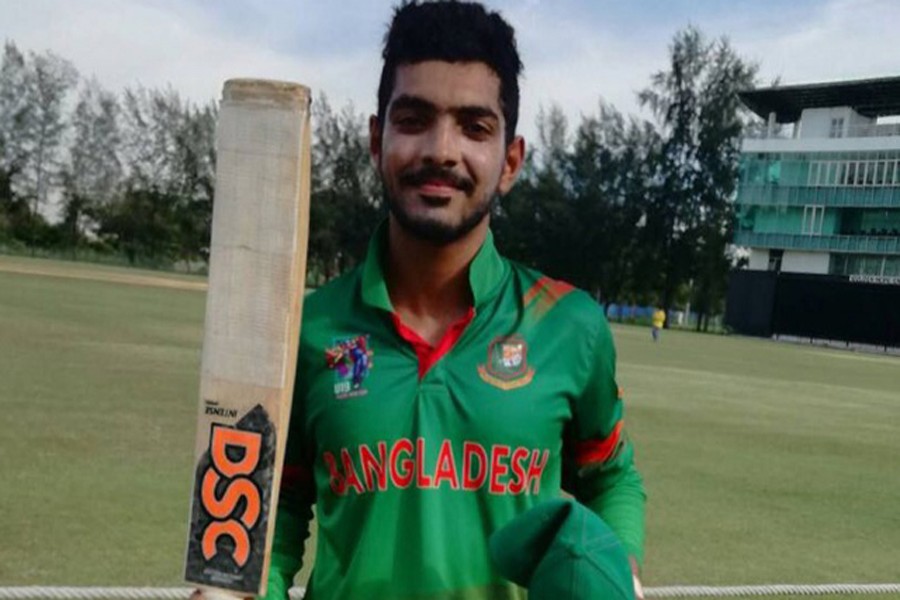 Towhid Hridoy poses with his bat after scoring century in the match between Bangladesh and Malaysia during the ACC Youth Asia Cup Cricket 2017 at Bayuemas Oval in Kuala Lumpur on Monday. 	— bdnews24.com