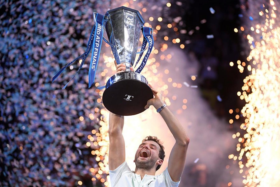 Bulgaria's Grigor Dimitrov celebrates with the trophy after winning the final against Belgium's David Goffin. - Reuters photo