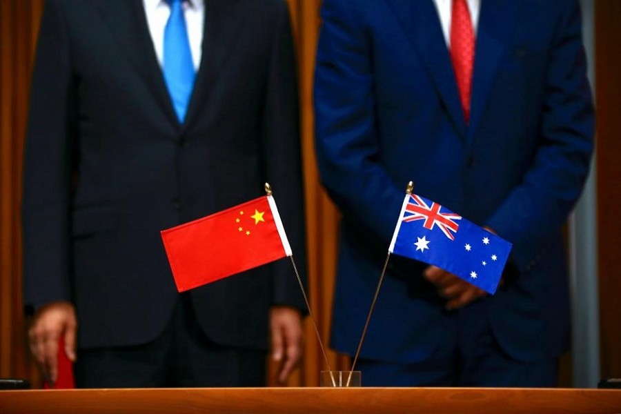 Australia's Prime Minister Malcolm Turnbull stands with Chinese Premier Li Keqiang before the start of an official signing ceremony at Parliament House in Canberra, Australia, March 24, 2017. Reuters/Files