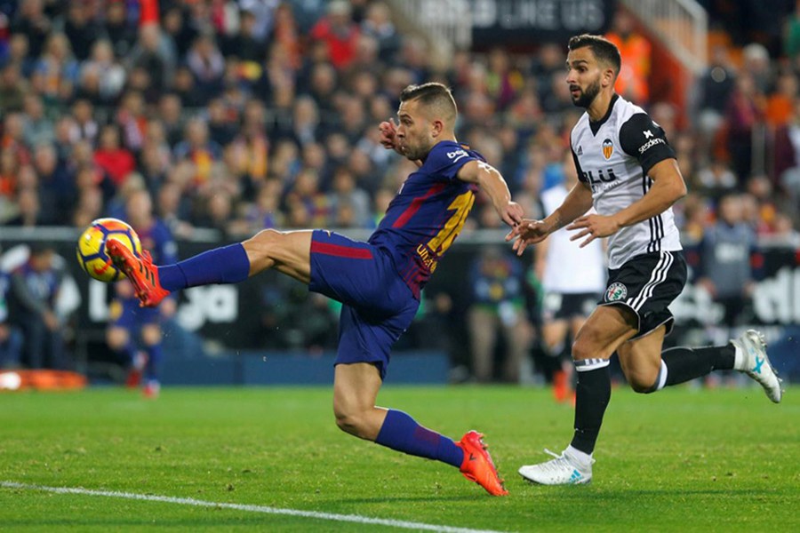 Alba scores a stunning equaliser against former club Valencia to preserve Barcelona's unbeaten record in La Liga. - Reuters photo