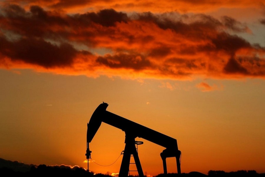 A oil pump is seen at sunset outside Scheibenhard, near Strasbourg, France, October 6, 2017. Reuters