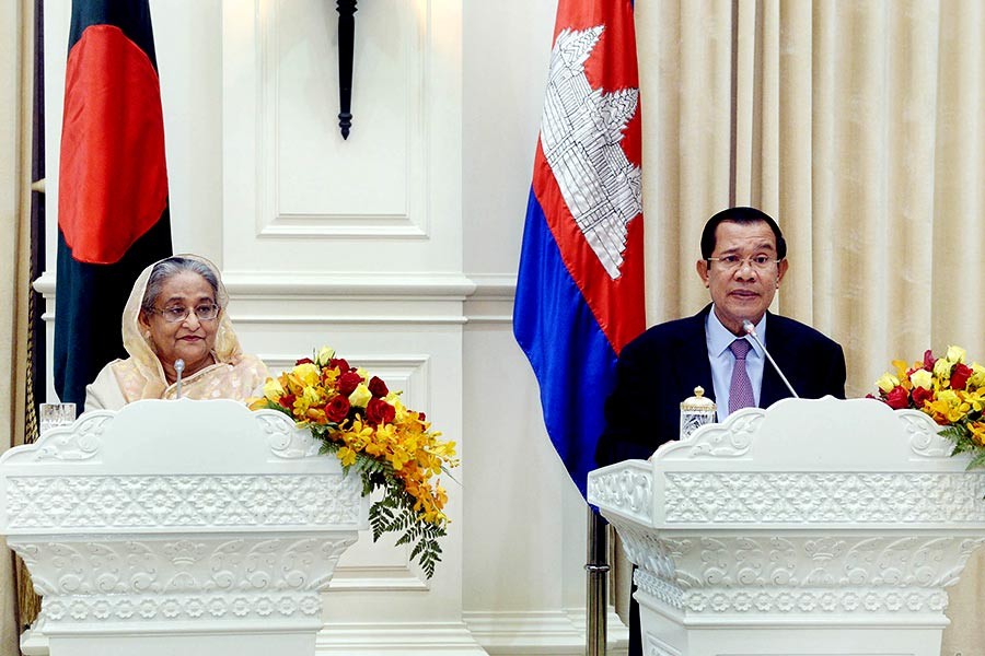 Bangladesh Prime Minister Sheikh Hasina and her Cambodian counterpart address a press conference after signing 11 deals at Phnom Penh on Monday. -Focus Bangla Photo