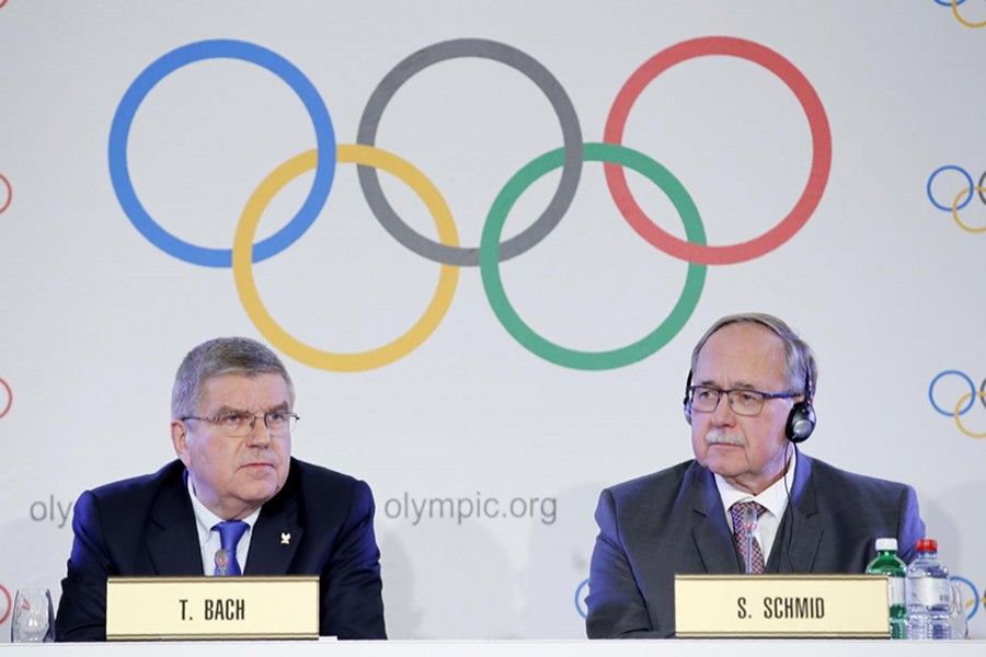 Samuel Schmid, Chair of the IOC Disciplinary Commission, and Thomas Bach, President of the International Olympic Committee, attend a news conference in Lausanne, Switzerland on Tuesday. - Reuters photo