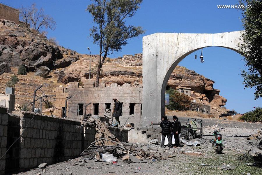 People inspect the site of airstrikes on Yemen's state satellite television station in Sanaa, Yemen, on Dec. 9, 2017: Xinhua