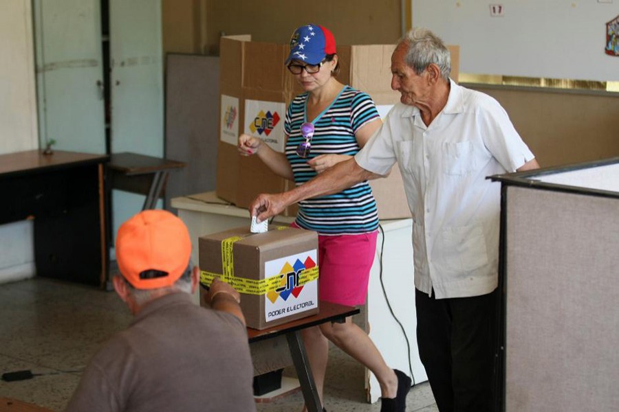 A man casts his vote at a polling station during a nationwide election for new mayors, in Maracaibo, Venezuela on Sunday. - Reuters photo