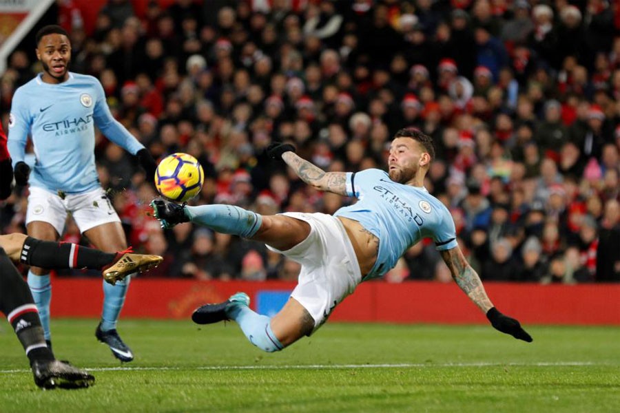 Manchester United vs Manchester City - Old Trafford, Manchester, Britain - December 10, 2017 Manchester City's Nicolas Otamendi scores their second goal. (Reuters Photo)