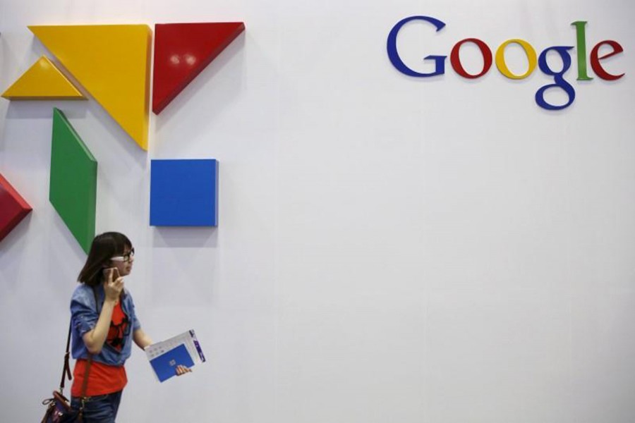 A woman walks past a logo of Google at the Global Mobile Internet Conference (GMIC) 2015 in Beijing, China. - Reuters file photo