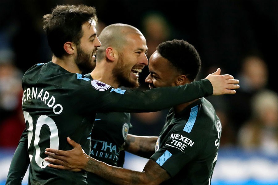 Manchester City's David Silva celebrates scoring their third goal with Raheem Sterling and Bernardo Silva. (Reuters Photo)