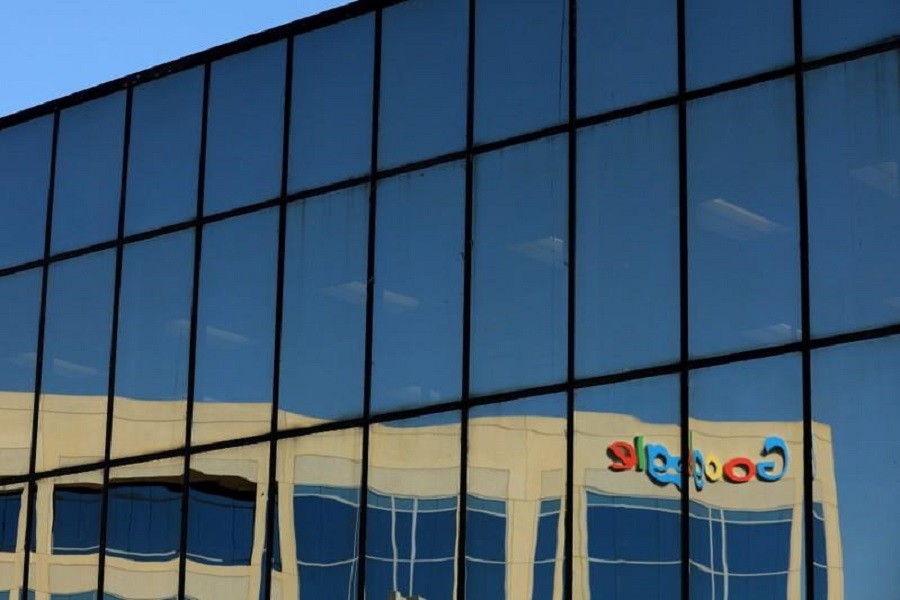 The Google logo is shown reflected on an adjacent office building in Irvine, California, U.S. August 7, 2017. Reuters/File Photo