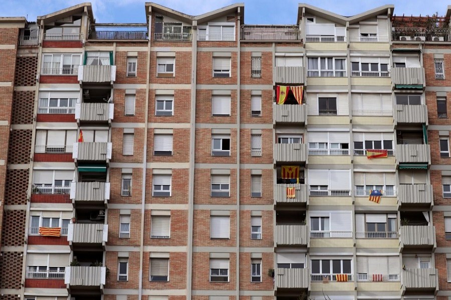 Flags of Spain, Catalonia and Esteladas (Catalan separatist flag) hang from balconies and windows of a building in Barcelona, Spain, November 1, 2017. Reuters/Files