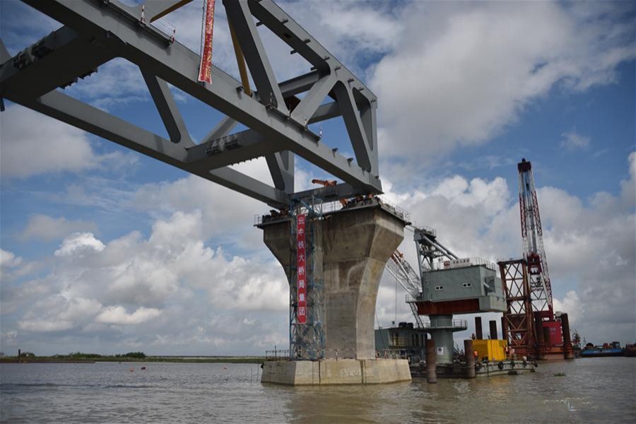 Construction workers work on Padma Bridge in Bangladesh on September 30 last. - Xinhua file photo