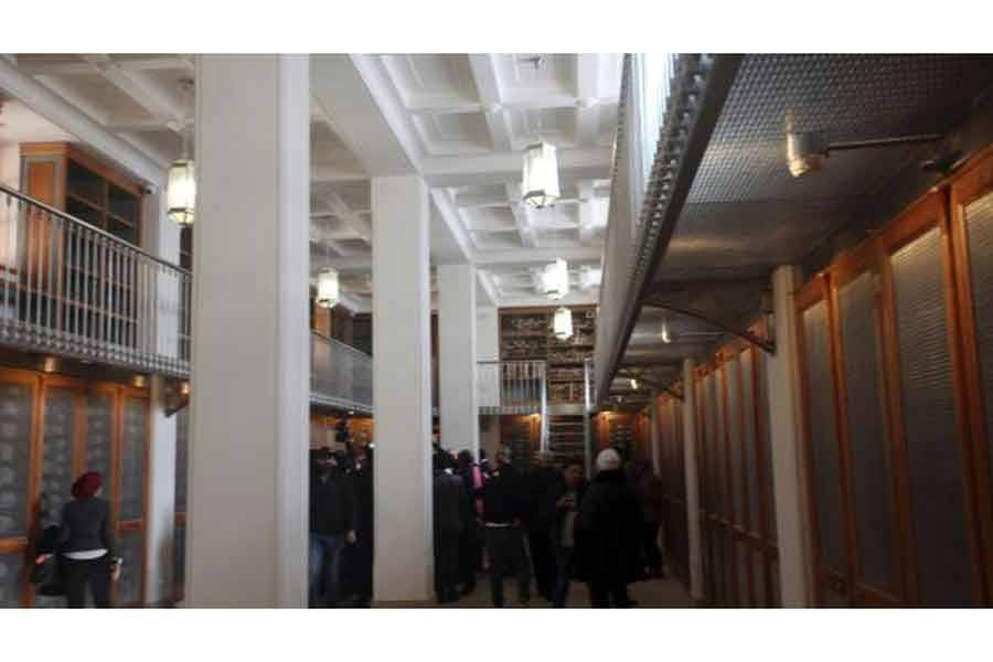 Officials walk around the main hall of the newly opened Saint Cathrine Ancient Library in South Sinai, Egypt on Saturday, Dec. 16, 2017. --AP photo