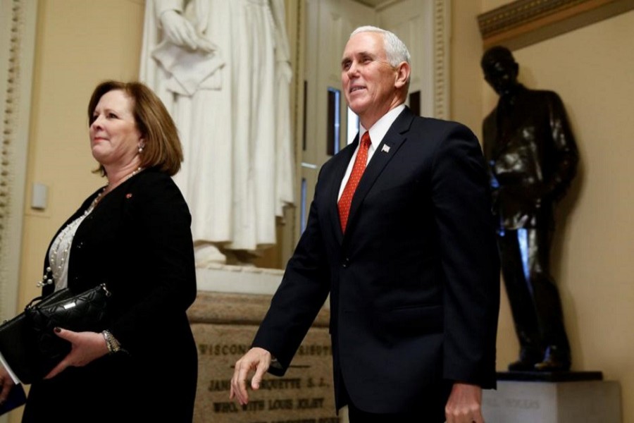 US Vice President Mike Pence walks outside the House of Representatives at the Capitol in Washington, December 19, 2017. Reuters