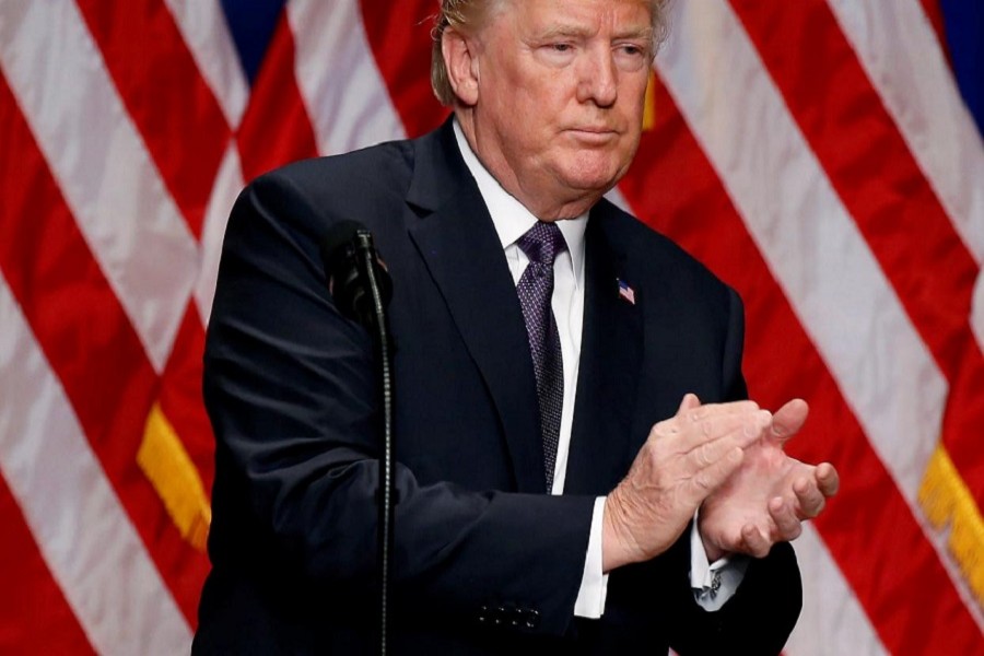 US President Donald Trump claps after delivering remarks regarding the Administration's National Security Strategy in Washington DC, December 18, 2017. Reuters