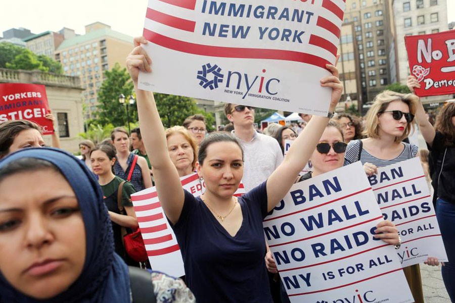 Protesters hold signs against US President Donald Trump's limited travel ban in New York City, US on June 29, 2017. (Reuters)