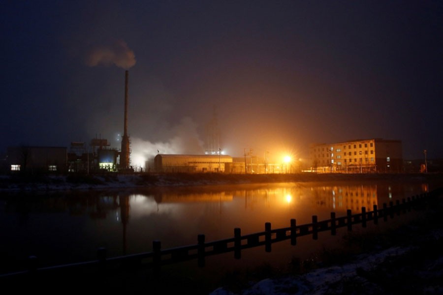 Steam and smoke rise from a factory in the Guantao Chemical Industry Park in the early morning near the villages of East Luzhuang and Nansitou, Hebei province, February 22, 2017. Reuters /File Photo