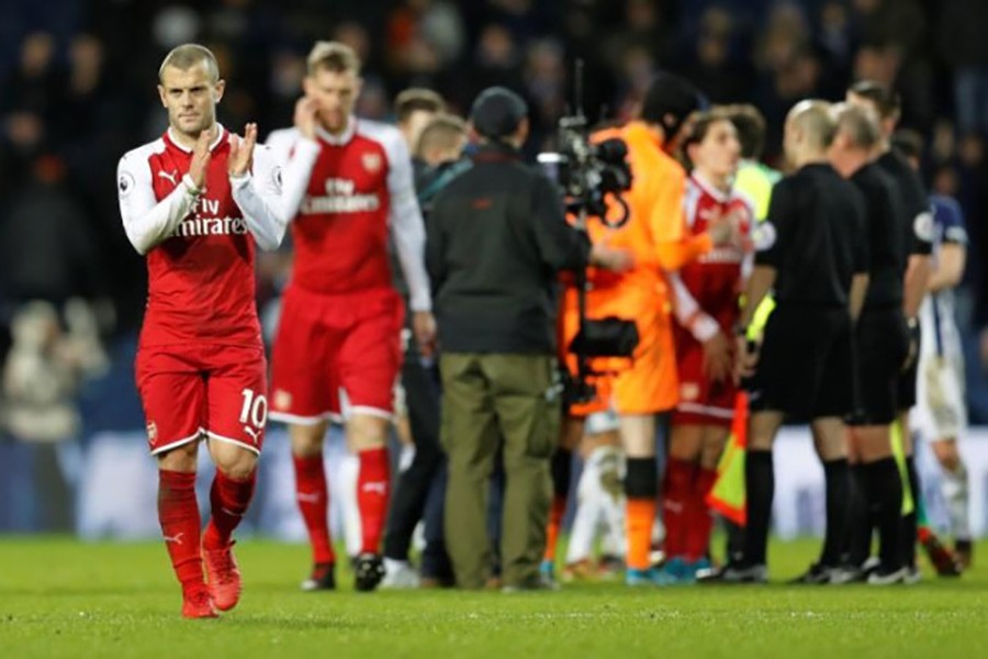 Arsenal's Jack Wilshere applauds fans after the match. - Reuters photo