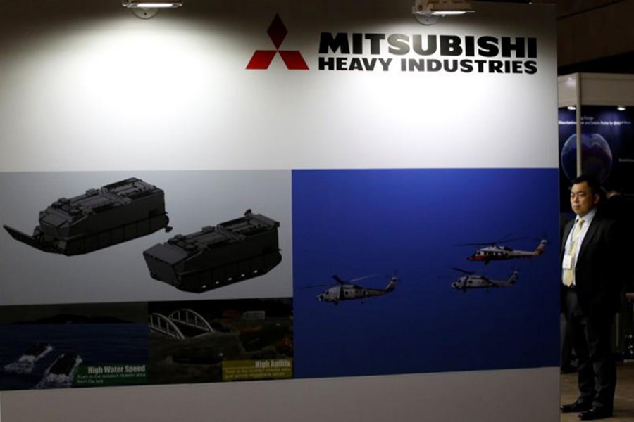 A visitor is seen at Mitsubishi Heavy Industries' booth during the Maritime Air Systems and Technologies Asia (MAST) show in Chiba, Japan on June 12, 2017. - Reuters file photo