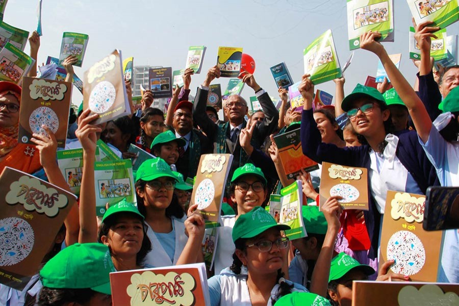 Education Minister Nurul Islam Nahid distributes books at the complex of Azimpur Girls' School and College on Monday. - Focus Bangla photo