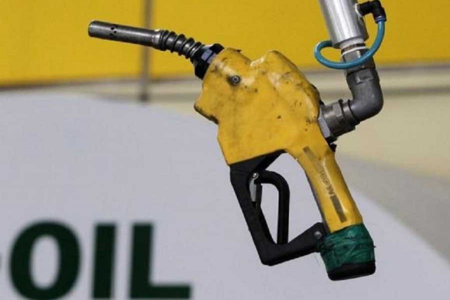 A gas pump is seen hanging from the ceiling at a petrol station in Seoul June 27, 2011. Reuters