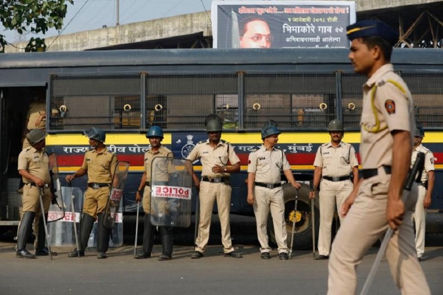 Policemen stand guard at a traffic junction in Mumbai, India, January 3, 2018. Reuters