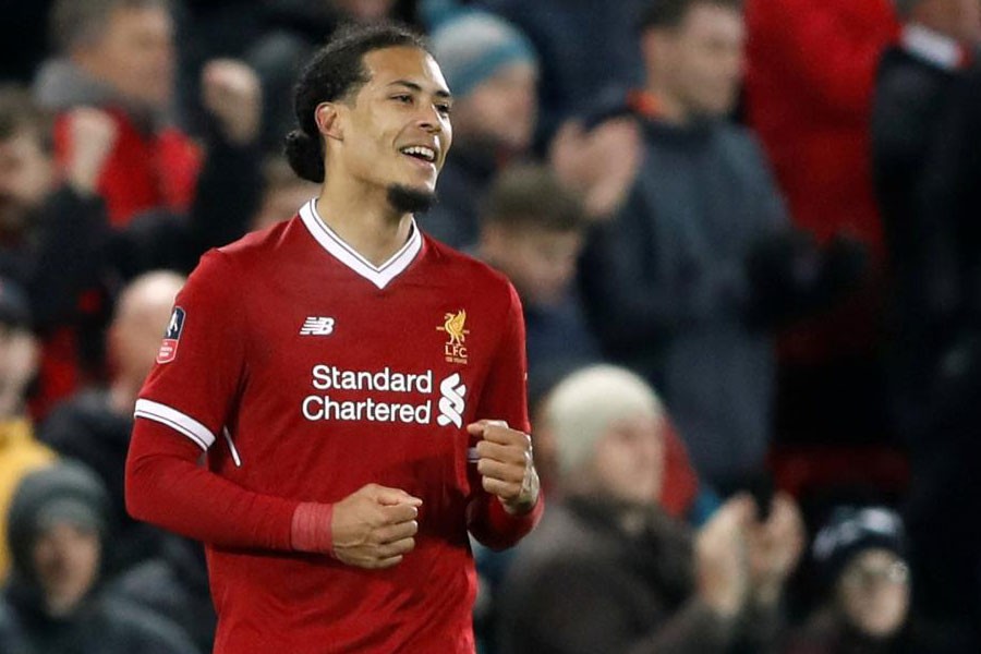 Soccer Football - FA Cup Third Round - Liverpool vs Everton - Anfield, Liverpool, Britain - January 5, 2018 Liverpool’s Virgil van Dijk celebrates at the end of the match Action. (Reuters)