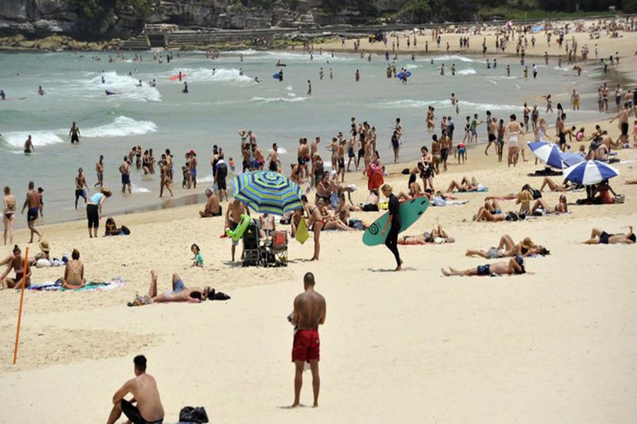 In this Tuesday, Dec 13, 2016 photo, people gather on the sand at Bondi Beach in Sydney, Australia. Photo: AP