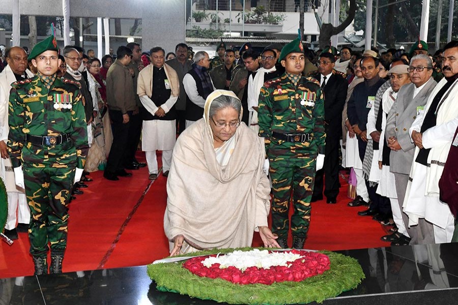 Prime Minister Sheikh Hasina placing wreaths at the mural of the Father of the Nation in front of Bangabandhu Memorial Museum at Dhanmondi on Wednesday morning.