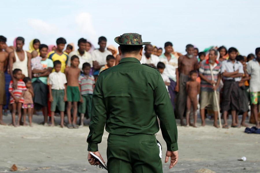 Rohingya Muslims wait to cross the border to Bangladesh, in a temporary camp outside Maungdaw, northern Rakhine state, Myanmar on November 12, 2017. - Reuters file photo