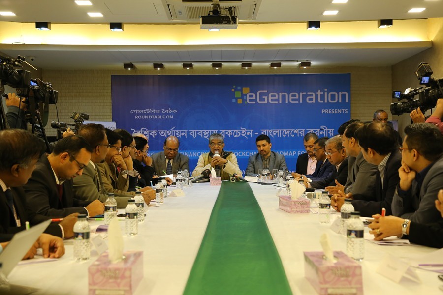 Posts and Telecommunications Minister Mustafa Jabbar speaks as the Chief Guest at the eGeneration Ltd-organised roundtable on 'Disruptive Global Financing with Blockchain-Roadmap for Bangladesh' in the capital on Wednesday.