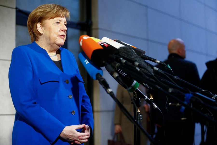 Acting German Chancellor Angela Merkel arrives for exploratory talks about forming a new coalition government at the SPD headquarters in Berlin, Germany on Thursday. - Reuters photo