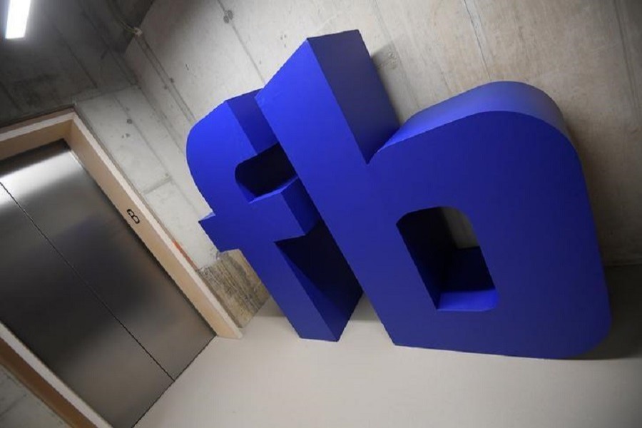 A giant logo is seen at Facebook's headquarters in London, Britain, December 4, 2017. Reuters/File Photo