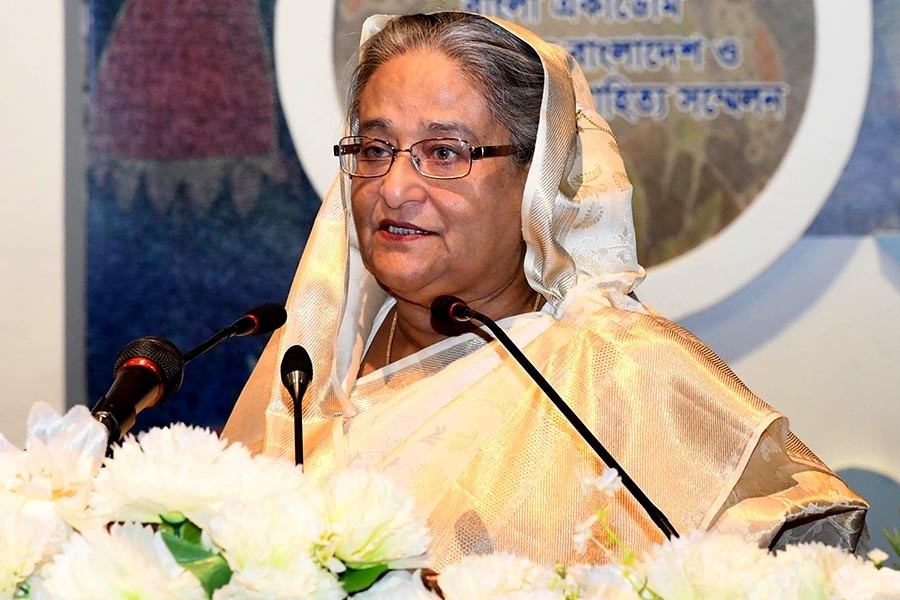 Prime Minister Sheikh Hasina addresses the three-day International Bengali Literature Conference-1424 at the Osmani Memorial Auditorium on Saturday. -Focus Bangla Photo