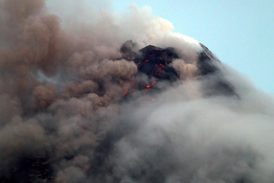 Clouds partially cover Mayon volcano's crater as it spews a column of ash during another mild eruption in Legazpi City, Albay province, south of Manila, Philippines Jan 16, 2018. Reuters